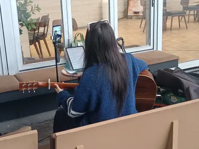 Woman playing guitar on Douyin live broadcast