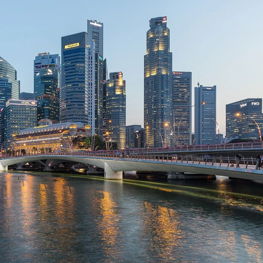 Skyline of the Central Business District of Singapore with Esplanade Bridge in the evening