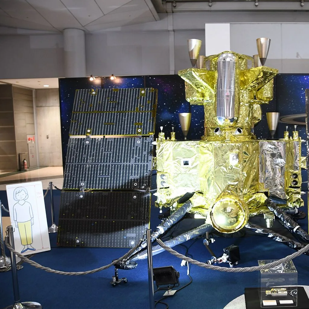 MMX spacecraft (scale model) behind view in 1F atrium of JA2024 at Tokyo Big Sight October 19, 2024