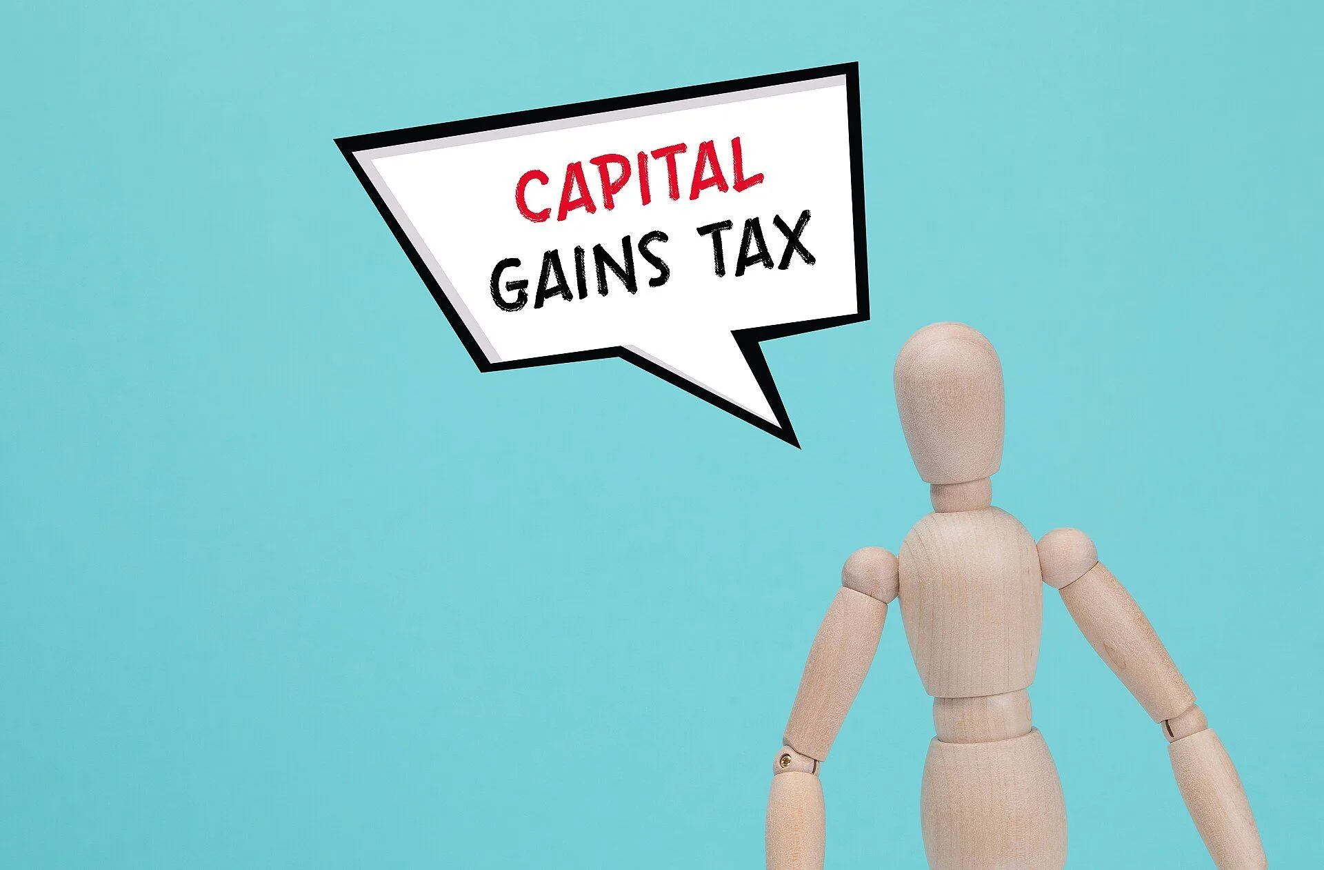 The wooden man and white cloud with text CAPITAL GAINS TAX