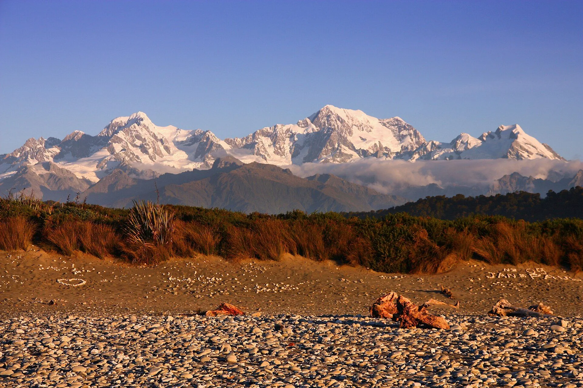 009 NZ Southern Alps mountain landscape in New Zealand seen from Gillespies Beach, West Coast - sunset light