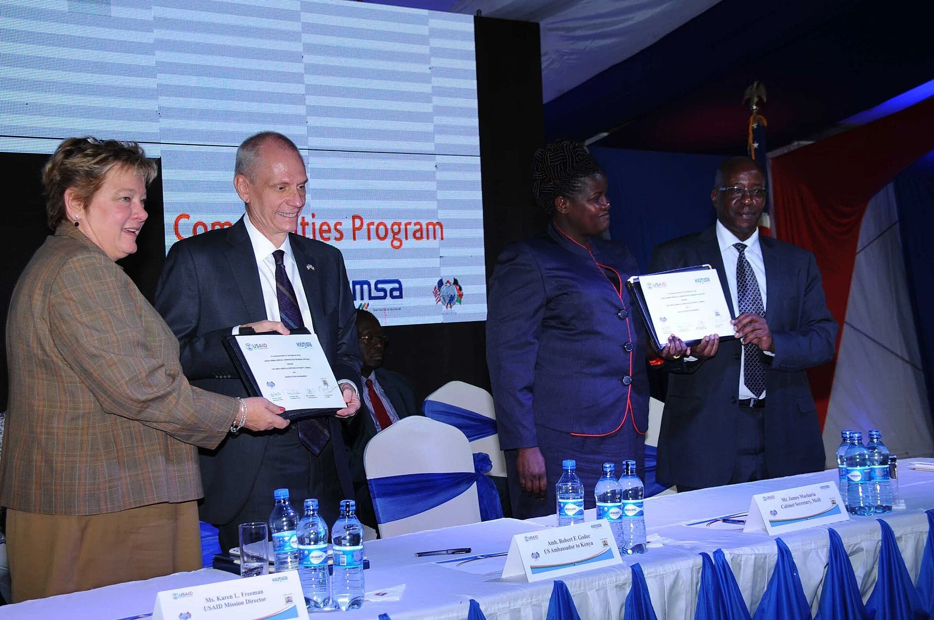 Amb Godec, USAID Kenya Country Director Karen Freeman, Ministry of Health PS Dr Kassachoon and KEMSA Managing Director Dr Munya pose with MCP contract