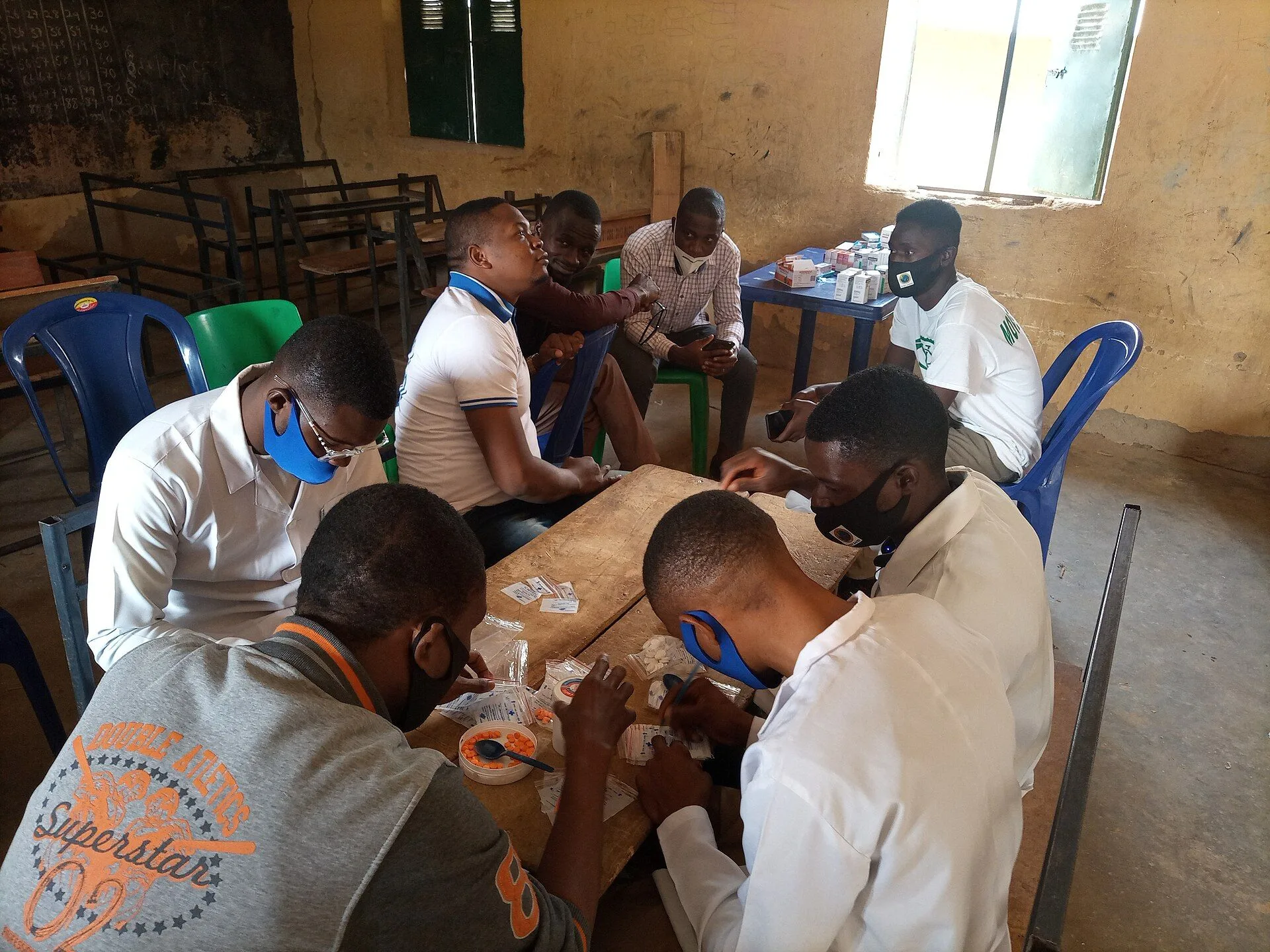 Repackaging medicines at a community medical outreach