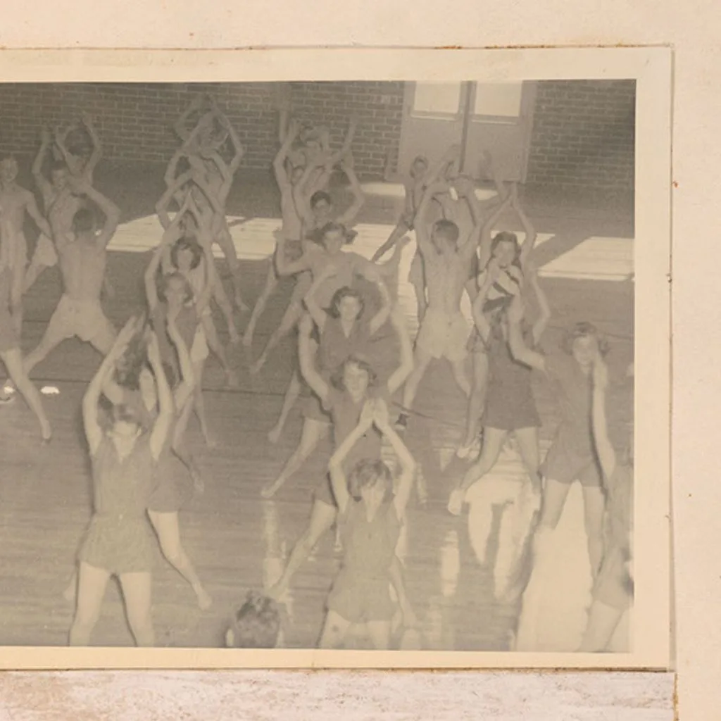 Photograph of high school girls performing calisthenics in a physical education class at Screven County High School, Sylvania, Georgia, 1951 - DPLA - 8673421857267b41aed32754a434e46c